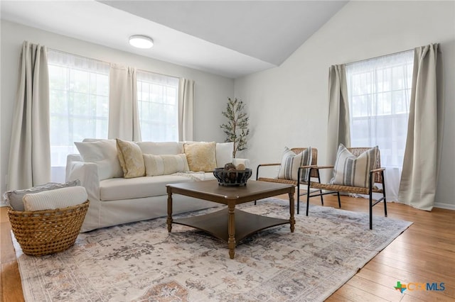 2002 E Young Ave, Temple, TX 76501 - living area featuring wood finished floors and vaulted ceiling
