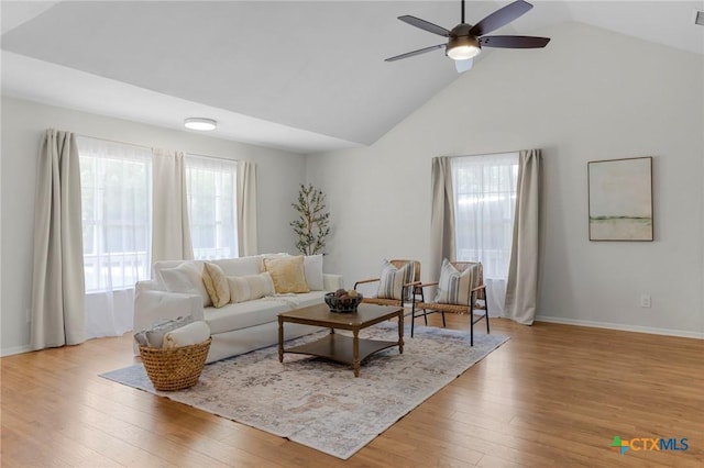 2002 E Young Ave, Temple, TX 76501 - living area with healthy amount of natural light, wood finished floors, ceiling fan, and high vaulted ceiling