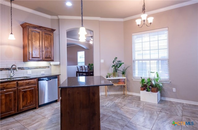 kitchen featuring a notable chandelier, pendant lighting, crown molding, stainless steel dishwasher, and sink