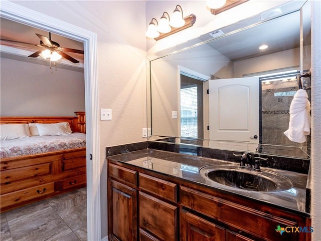 bathroom featuring ceiling fan and vanity