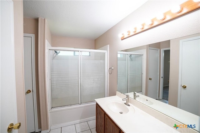 4607 Stanford Dr, Killeen, TX 76542 - bathroom featuring vanity, tile patterned floors, and shower / bath combination with glass door