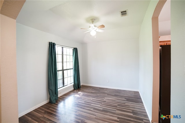 4607 Stanford Dr, Killeen, TX 76542 - empty room featuring ceiling fan, dark wood finished floors, arched walkways, and baseboards