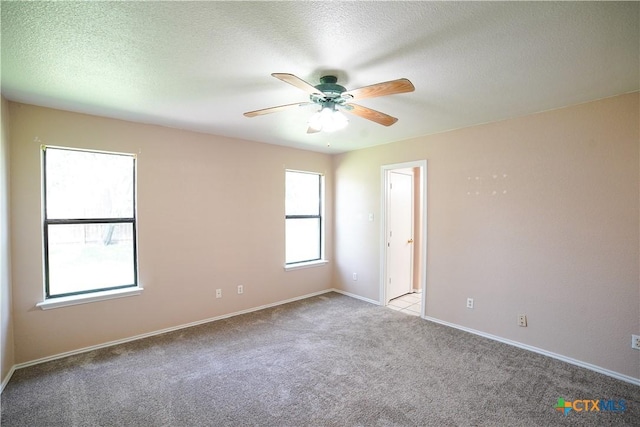 4607 Stanford Dr, Killeen, TX 76542 - carpeted empty room with ceiling fan, baseboards, and a textured ceiling