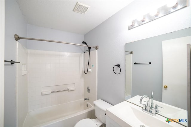4607 Stanford Dr, Killeen, TX 76542 - bathroom featuring toilet, a sink, and bathing tub / shower combination