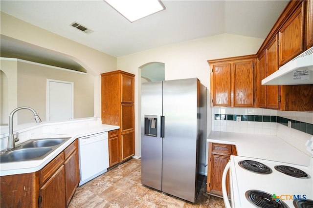 4607 Stanford Dr, Killeen, TX 76542 - kitchen with white appliances, a sink, under cabinet range hood, tasteful backsplash, and light countertops