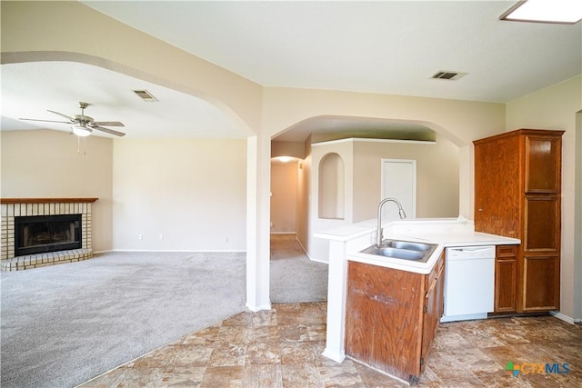 4607 Stanford Dr, Killeen, TX 76542 - kitchen featuring white dishwasher, a sink, brown cabinetry, and a ceiling fan