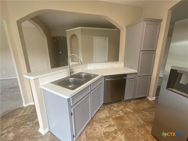 4607 Stanford Dr, Killeen, TX 76542 - kitchen with stainless steel dishwasher, gray cabinetry, a peninsula, and light countertops