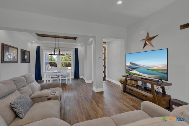315 Hilltop Rdg, New Braunfels, TX 78132 - living room with a tray ceiling, recessed lighting, wood finished floors, baseboards, and a notable chandelier