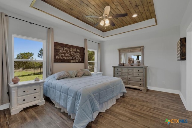 315 Hilltop Rdg, New Braunfels, TX 78132 - bedroom with a ceiling fan, wood ceiling, wood finished floors, a raised ceiling, and baseboards