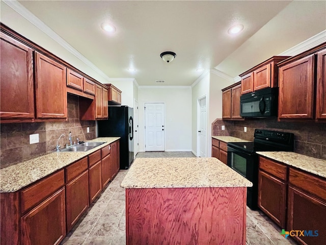 kitchen featuring black appliances, light stone counters, crown molding, a kitchen island, and sink