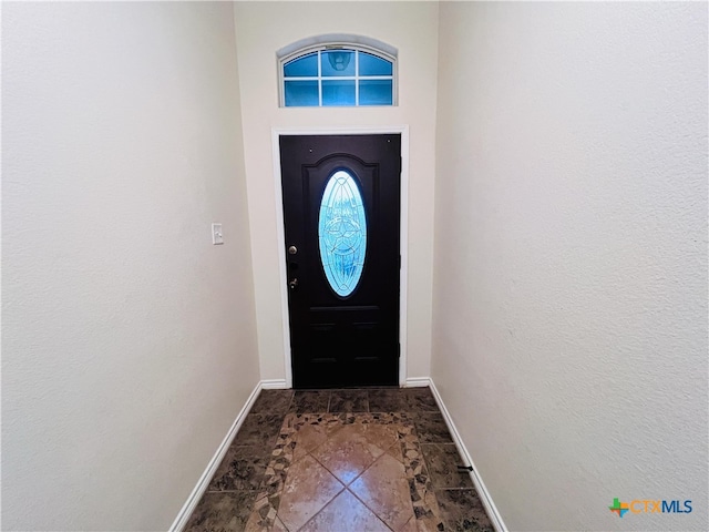 doorway featuring tile patterned flooring