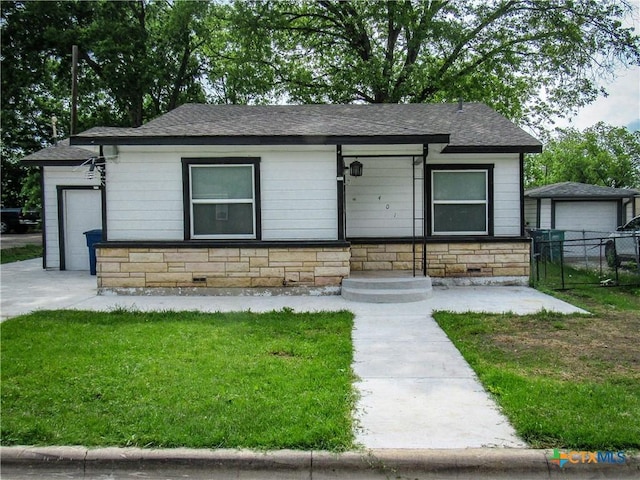 view of front of property with crawl space, fence, a front yard, and roof with shingles
