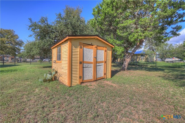 view of outdoor structure with a yard