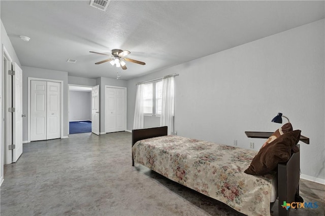 800 N Bishop St, San Marcos, TX 78666 - bedroom with a ceiling fan and two closets