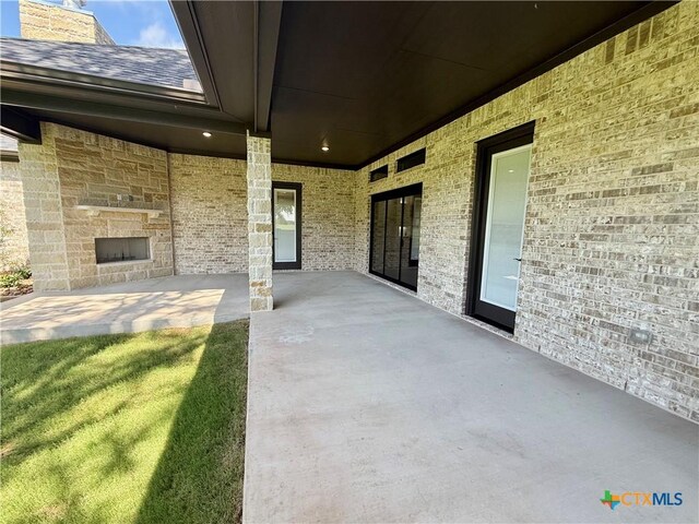 5101 Sunflower Ln, Temple, TX 76502 - view of patio / terrace featuring an outdoor stone fireplace