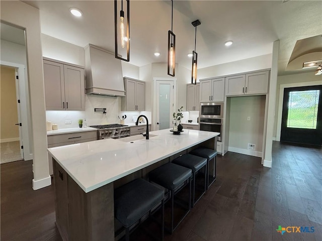 5101 Sunflower Ln, Temple, TX 76502 - kitchen featuring premium range hood, appliances with stainless steel finishes, gray cabinetry, dark wood finished floors, and recessed lighting