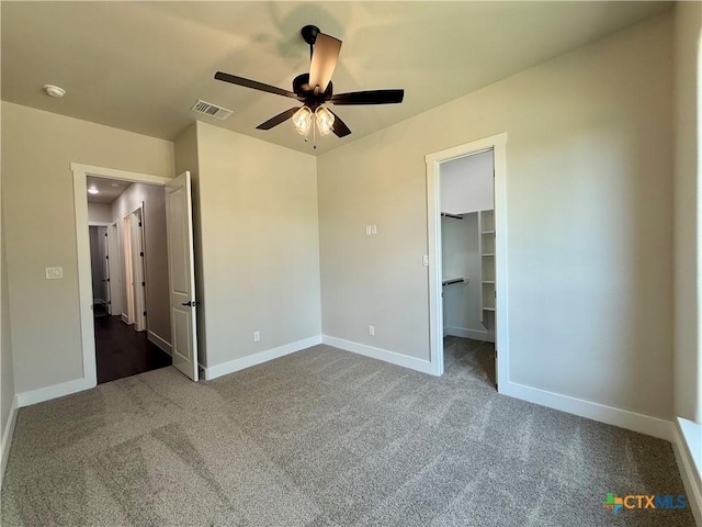 5101 Sunflower Ln, Temple, TX 76502 - unfurnished bedroom featuring carpet floors, a walk in closet, a ceiling fan, and a closet