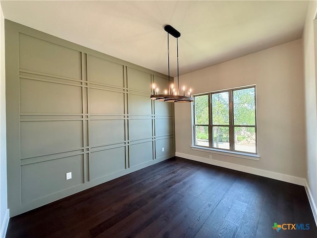 5101 Sunflower Ln, Temple, TX 76502 - unfurnished dining area with a chandelier and dark wood-type flooring