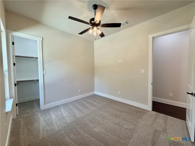 5101 Sunflower Ln, Temple, TX 76502 - unfurnished bedroom featuring carpet, a walk in closet, a ceiling fan, and a closet