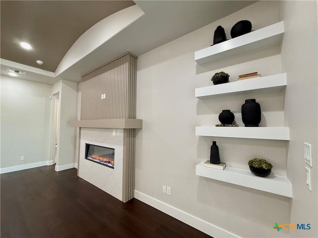 5101 Sunflower Ln, Temple, TX 76502 - unfurnished living room featuring dark wood-style flooring, a fireplace, lofted ceiling, and recessed lighting