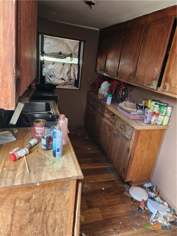 kitchen with dark wood-type flooring