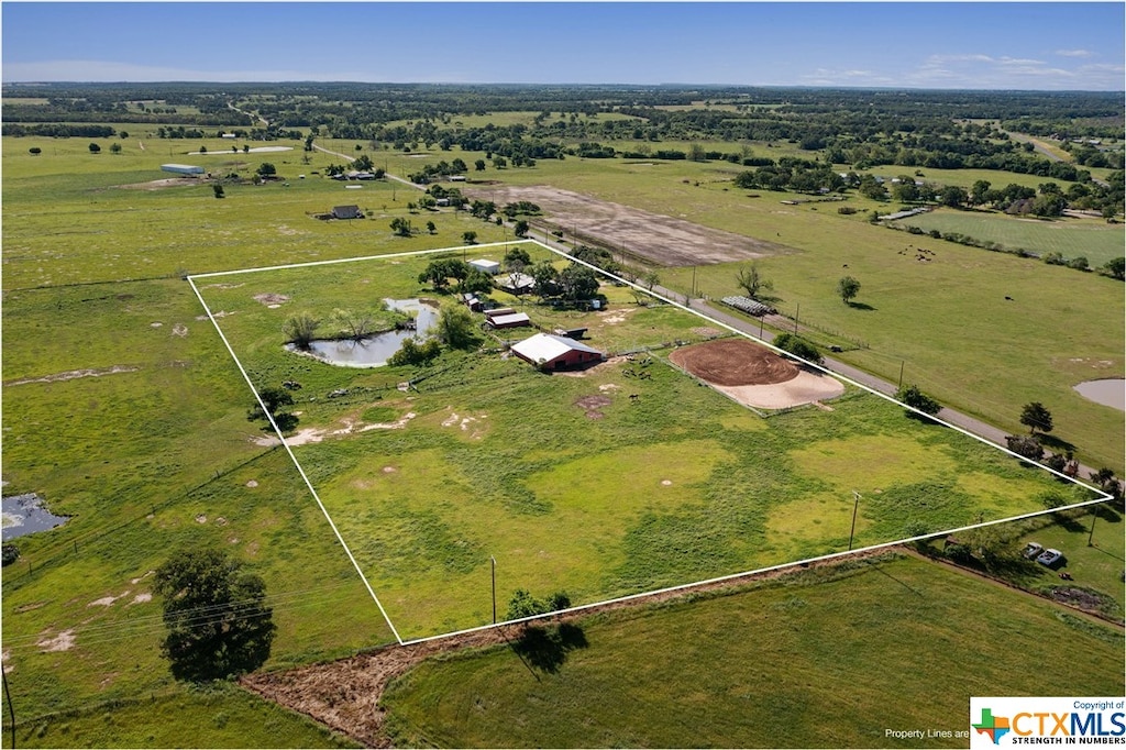 birds eye view of property with a rural view and a water view