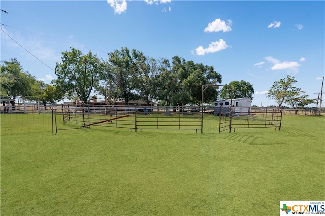 view of yard with a rural view