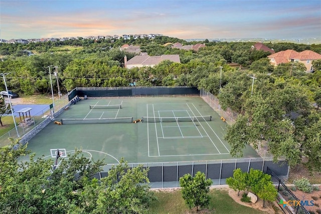 view of sport court with fence