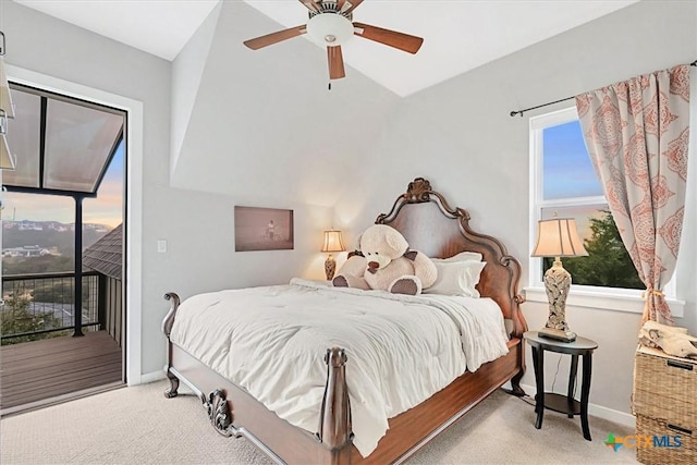 carpeted bedroom featuring access to outside, ceiling fan, and baseboards