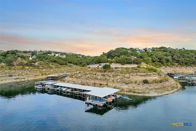 aerial view at dusk with a water view