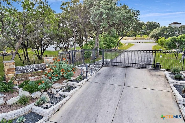 exterior space featuring a lawn and fence