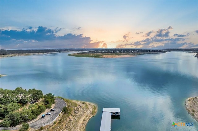 water view featuring a floating dock