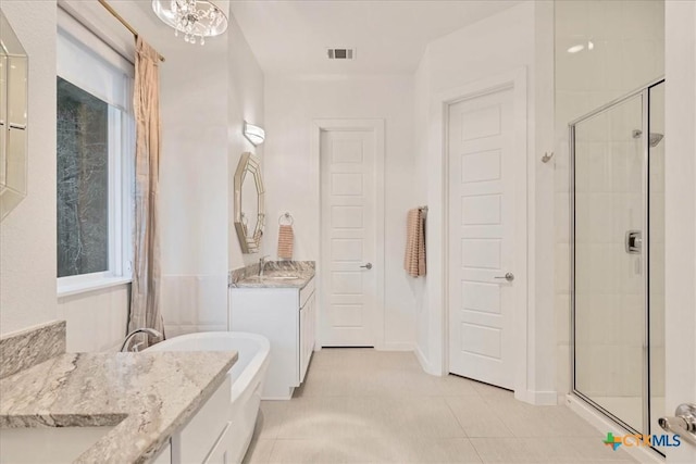 full bathroom featuring a shower stall, visible vents, tile patterned flooring, and vanity