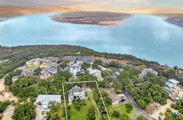 aerial view with a water view and a residential view