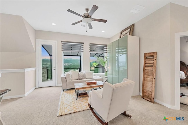 carpeted living room featuring ceiling fan, baseboards, and recessed lighting