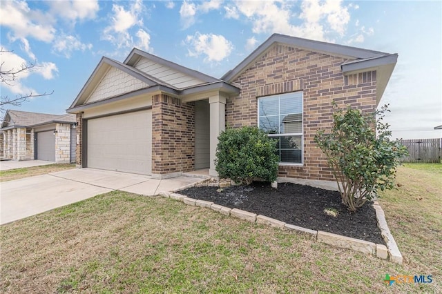 ranch-style home with brick siding, driveway, a front yard, and a garage