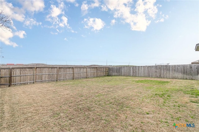 view of yard featuring a fenced backyard