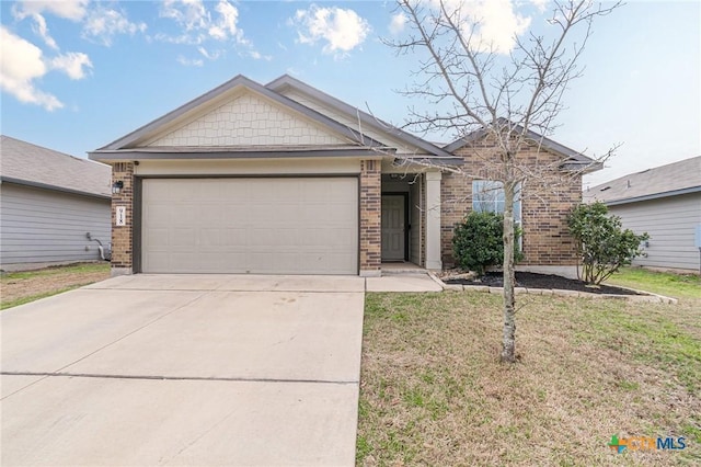 view of front of home featuring brick siding, an attached garage, driveway, and a front yard