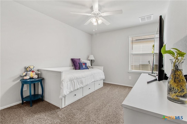 bedroom featuring ceiling fan and carpet