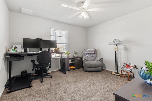 carpeted office space with ceiling fan