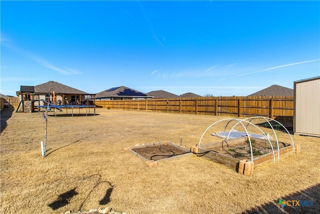 view of yard with a trampoline