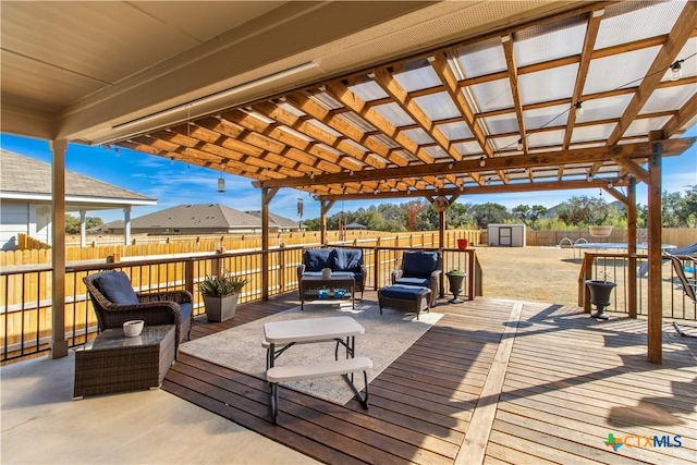 wooden deck with a pergola, outdoor lounge area, and a shed