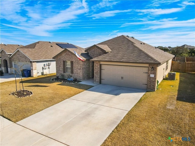 single story home with central air condition unit, a front yard, and a garage