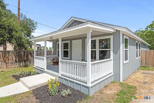 458 Seele St, New Braunfels, TX 78130 - view of front of home featuring covered porch, fence, and board and batten siding