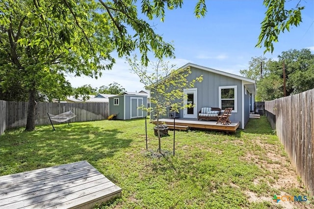 458 Seele St, New Braunfels, TX 78130 - view of yard featuring a deck, a storage shed, and an outbuilding