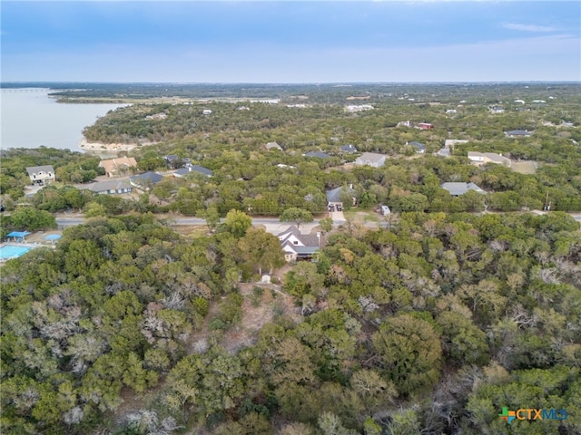 aerial view featuring a water view and a forest view