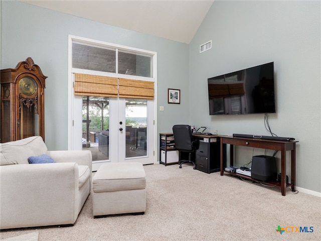 carpeted living room featuring high vaulted ceiling, french doors, visible vents, and baseboards