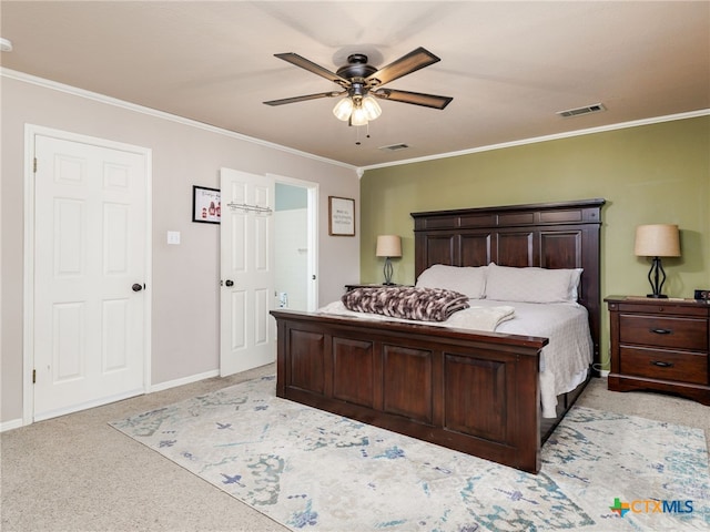 bedroom with light carpet, ornamental molding, visible vents, and a ceiling fan