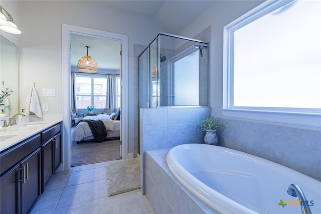 bathroom with vanity, tile patterned flooring, and shower with separate bathtub