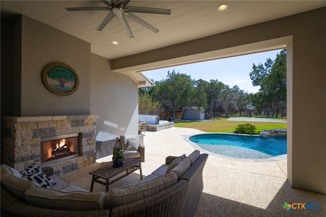 pool with a ceiling fan, a shed, a fenced backyard, an outdoor structure, and a patio area